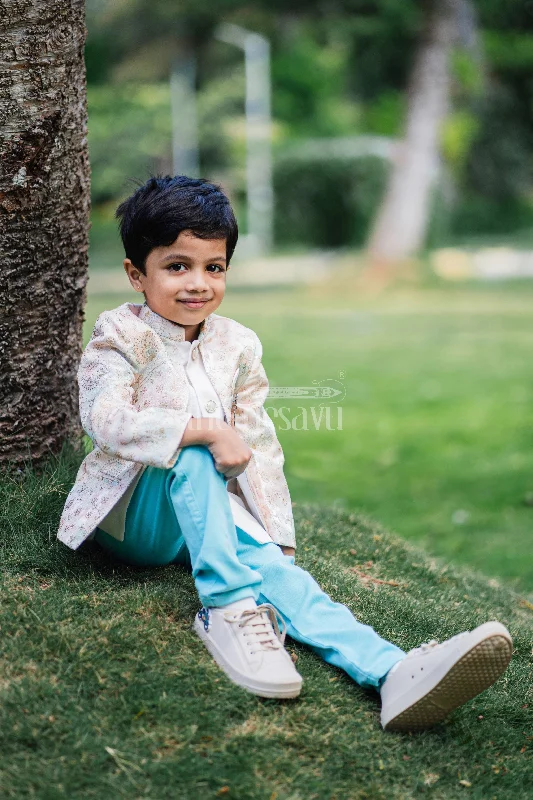 Boys Sherwani Set with Pastel Floral Jacket and Blue Trousers for Weddings and Festivals Front Pockets Side Pockets Patch Pockets Boys Sherwani Set with Pastel Floral Jacket and Blue Trousers for Weddings and Festivals Front Pockets Side Pockets Patch Pockets
